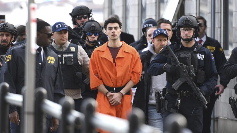 Luigi Mangione, a suspect in the fatal shooting of United Healthcare CEO Brian Thompson, is escorted by police, Thursday, Dec. 19, 2024, in New York. 