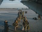 Russian troops board a military aircraft in Grozny, Russia, Dec. 4, 2023.  From murder suspects to immigrants to a former Olympic gold medallist, Russia pressures those it thinks should fight in Ukraine. 