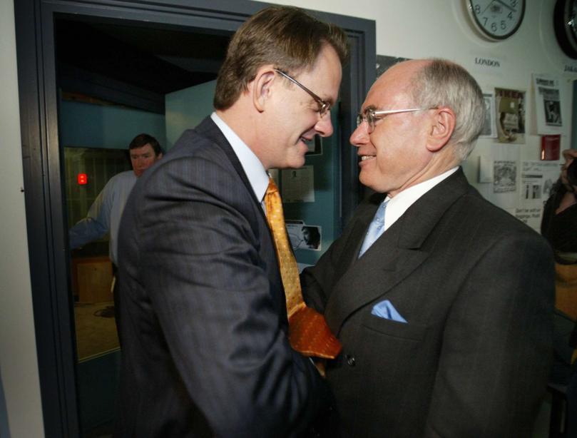 Back in 2004: Prime Minister John Howard and Opposition Leader Mark Latham crossing paths on the final day of campaigning in the 2004 Federal Election.