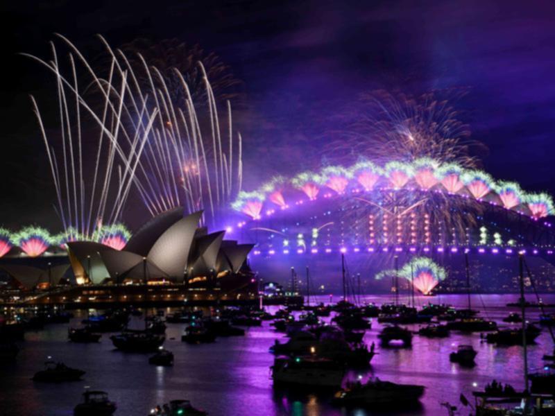 Fireworks have dazzled crowds who gathered near the shores of the Sydney Harbour. 