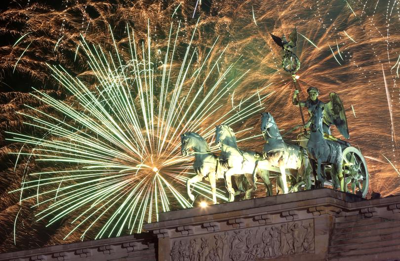 Fireworks explode over the Brandenburg Gate at midnight on New Year's Day, on January 01, 2025 in Berlin, Germany.