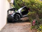 A Ferrari crashed through the wall of finance guru Mark Bouri’s former home in Watsons Bay on Thursday.