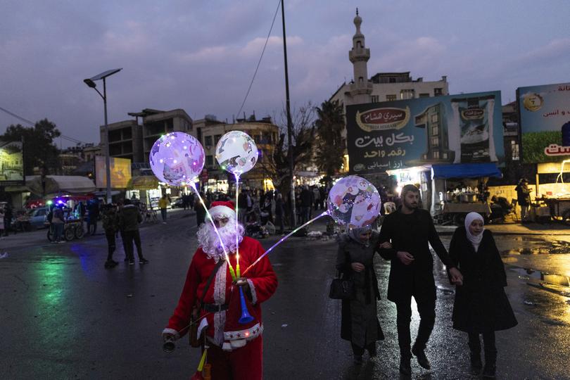 People gather to celebrate the holidays on New Year’s Eve in Damascus, Syria, on Tuesday, Dec. 31, 2024.