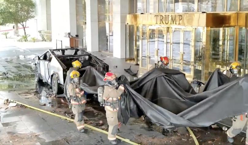 Images have been released by the Las Vegas Metropolitan Police Department shows firefighters removing a tarp after they extinguished a Tesla Cybertruck that exploded in front of the Trump Hotel.