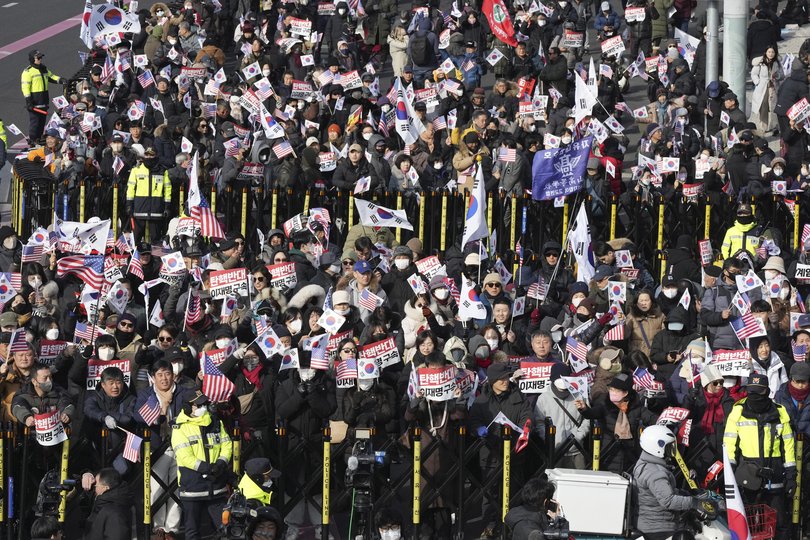 Supporters of impeached South Korean President Yoon Suk Yeol stage a rally to oppose a court having issued a warrant to detain Yoon.