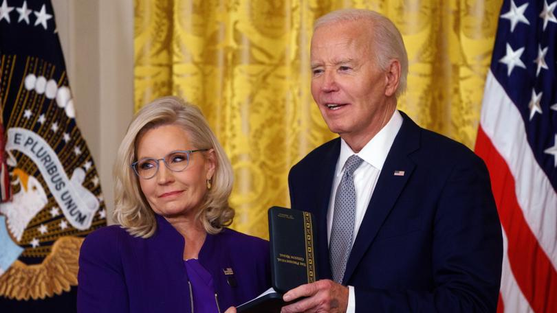 US President Joe Biden awards the Presidential Citizens Medal to Liz Cheney at the White House.