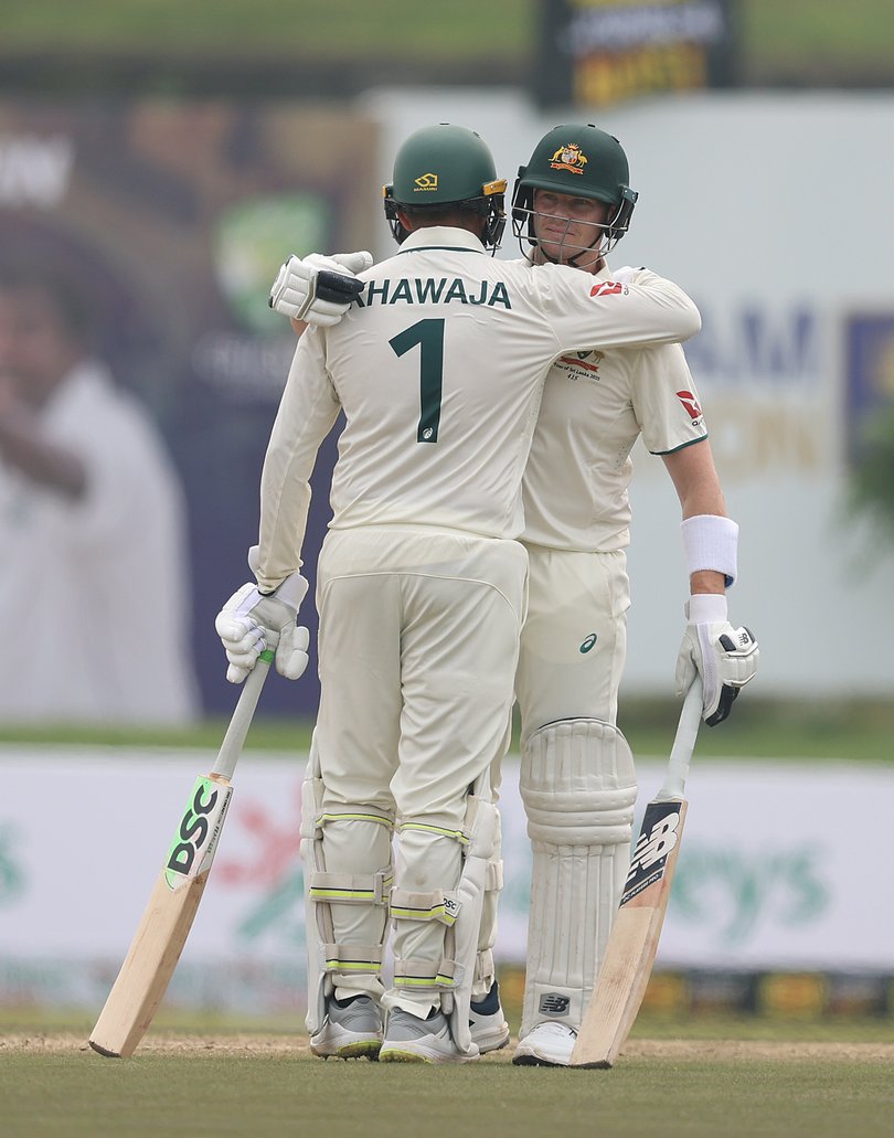 Steve Smith of Australia celebrates after scoring his ten thousandth run.