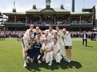 The Australian team pose for a photo after winning the fifth Test.