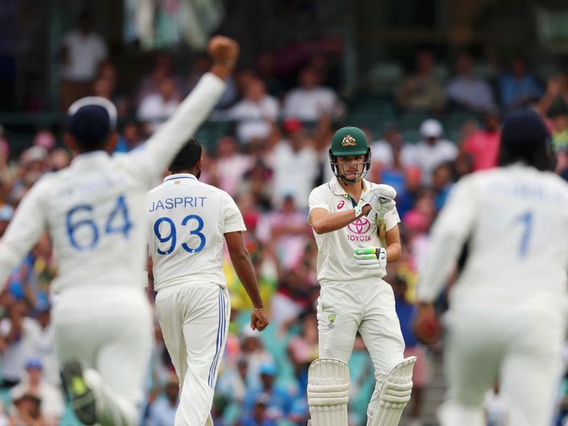 Indian players swarm Sam Konstas after Usman Khawaja’s dismissal.