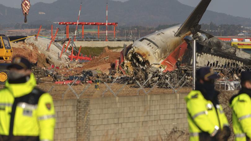 **EMBARGO: No electronic distribution, Web posting or street sales before 12:01 a.m. ET Sunday, Jan. 5, 2025. No exceptions for any reasons. EMBARGO set by source.** A damaged Jeju Air plane after a crash at Muan International Airport in Muan, South Korea, on Dec. 20, 2024. South Korea’s leading low-cost carrier, heavy with debt and its stock already near record lows, is now facing intense public and government scrutiny. (Chang W. Lee/The New York Times)