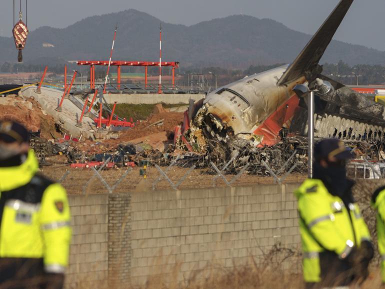 **EMBARGO: No electronic distribution, Web posting or street sales before 12:01 a.m. ET Sunday, Jan. 5, 2025. No exceptions for any reasons. EMBARGO set by source.** A damaged Jeju Air plane after a crash at Muan International Airport in Muan, South Korea, on Dec. 20, 2024. South Korea’s leading low-cost carrier, heavy with debt and its stock already near record lows, is now facing intense public and government scrutiny. (Chang W. Lee/The New York Times)