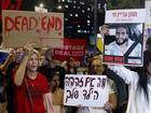 Families and supporters of hostages held in the Gaza Strip hold signs during a demonstration calling for an hostages deal.