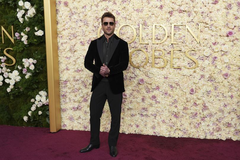 Glen Powell arrives at the 82nd Golden Globes on Sunday, Jan. 5, 2025, at the Beverly Hilton in Beverly Hills, Calif. (Photo by Jordan Strauss/Invision/AP)