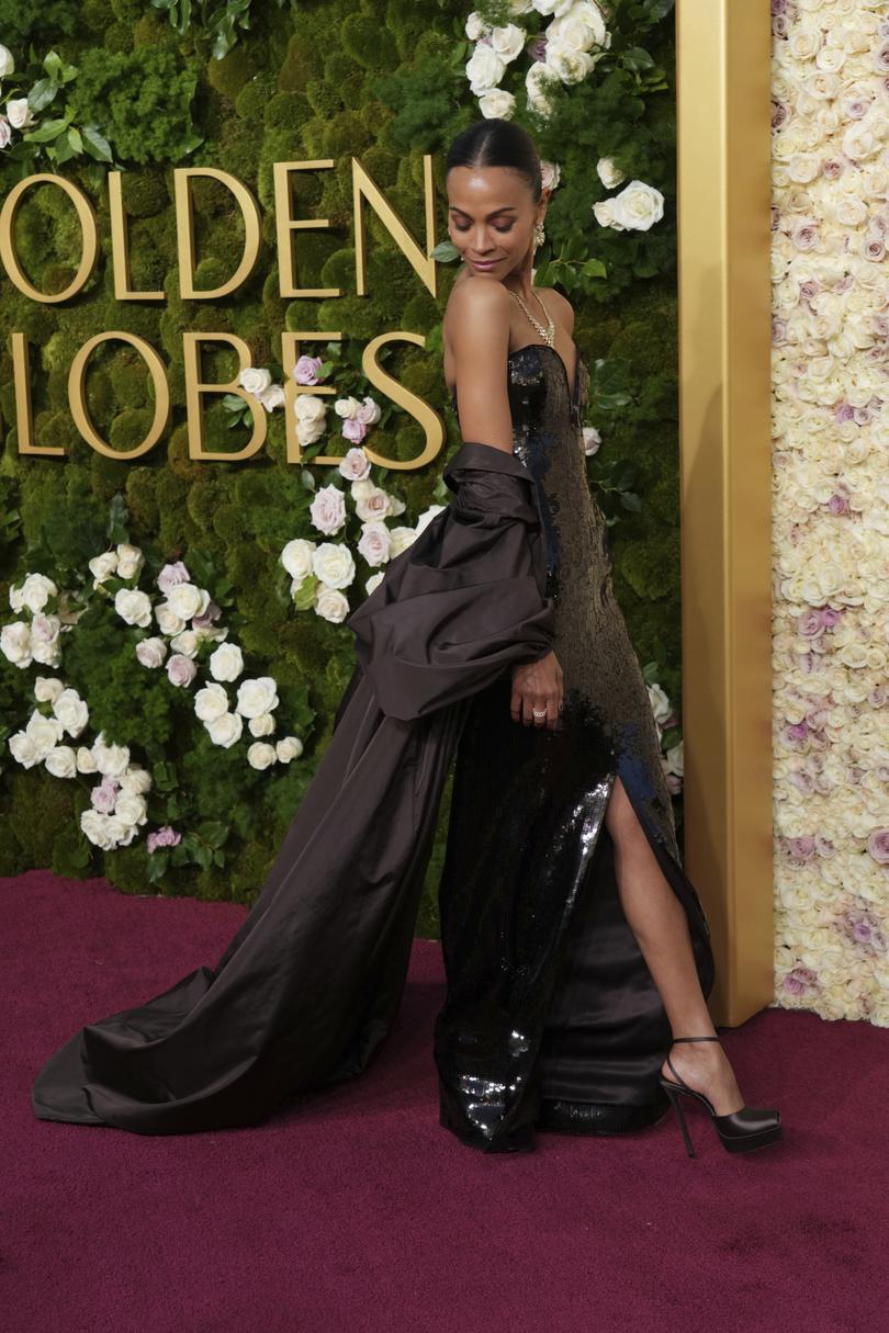 Zoe Saldana arrives at the 82nd Golden Globes on Sunday, Jan. 5, 2025, at the Beverly Hilton in Beverly Hills, Calif. (Photo by Jordan Strauss/Invision/AP)