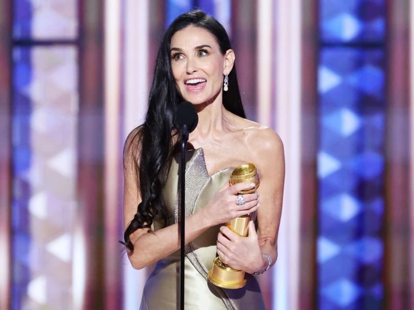 Demi Moore accepting her Golden Globe.