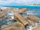 A woman has drowned after being swept off rocks at Salmon Beach near Esperance in WA.