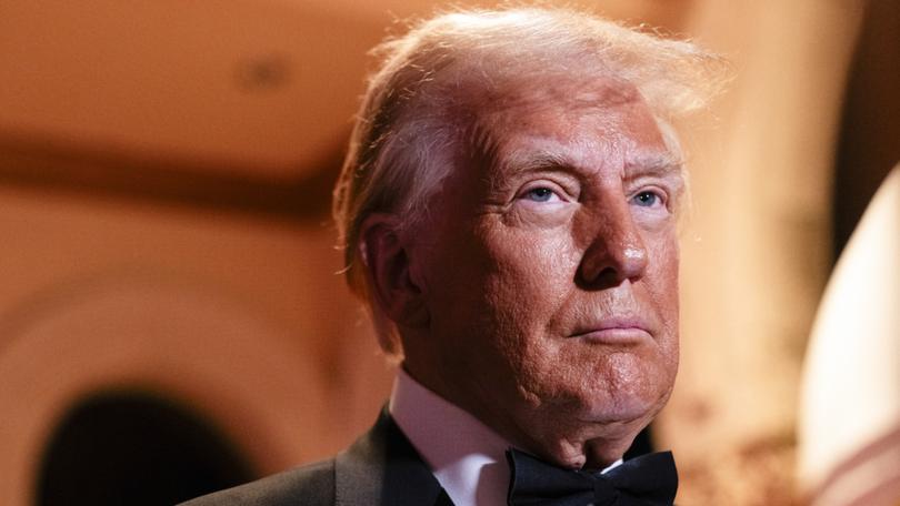 President-Elect Donald Trump speaks to reporters as he arrives to a New Year’s Eve event at Mar-o-Lago Club in Palm Beach, Fla., Dec. 31, 2024. President Joe Biden is bequeathing his successor a nation that by many measures is in good shape, even if voters remain unconvinced.(Eric Lee/The New York Times)