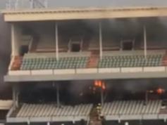 A fire is raging in the Caulfield racecourse grandstand.