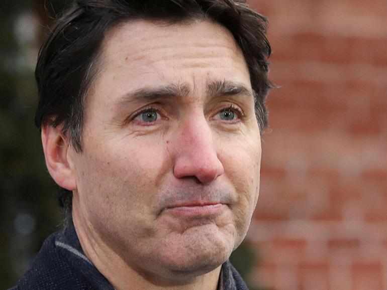 Canada's Prime Minister Justin Trudeau speaks to reporters, announcing he intends to step down as Liberal Party leader, but he will stay on in his post until a replacement has been chosen.