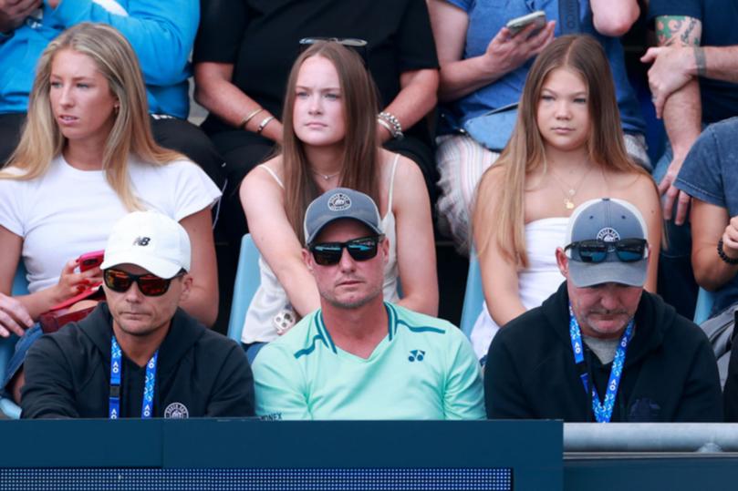 Lleyton Hewitt watches on as son Cruz crashes out. 