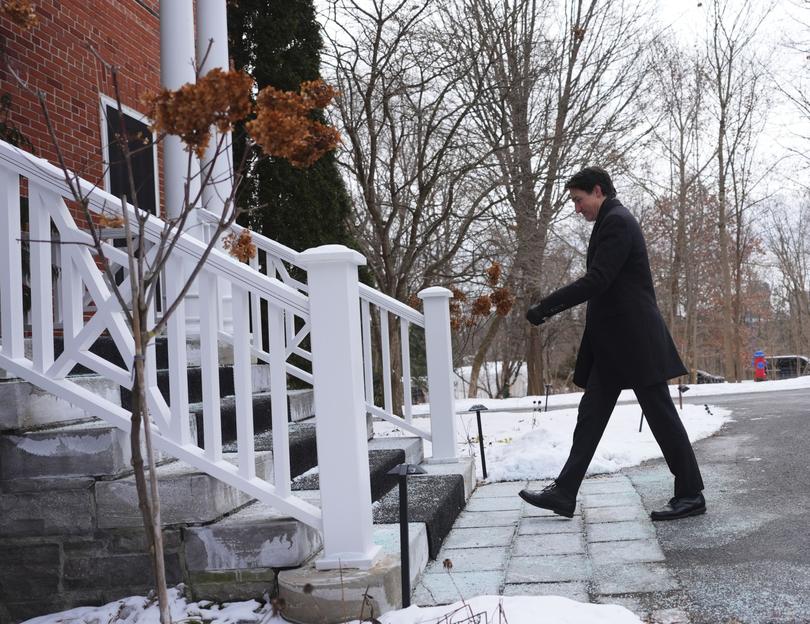 Canada Prime Minister Justin Trudeau leaves a news conference after announcing his resignation as Liberal leader.