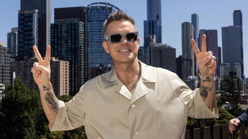 Robbie Williams has triumphed in a spat with neighbours over a sick tree.