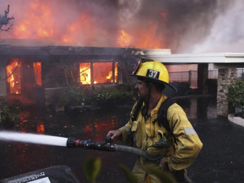 Large sections of the Pacific Palisades area in Los Angeles have burned amid strong winds. (AP PHOTO)