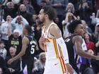 Atlanta Hawks guard Trae Young reacts to a game winning half court shot against the Utah Jazz.