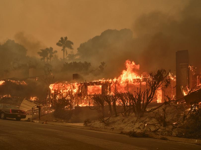 Fire destroys a home in the Pacific Palisades fire in Los Angeles, on Tuesday, Jan. 7, 2025. 