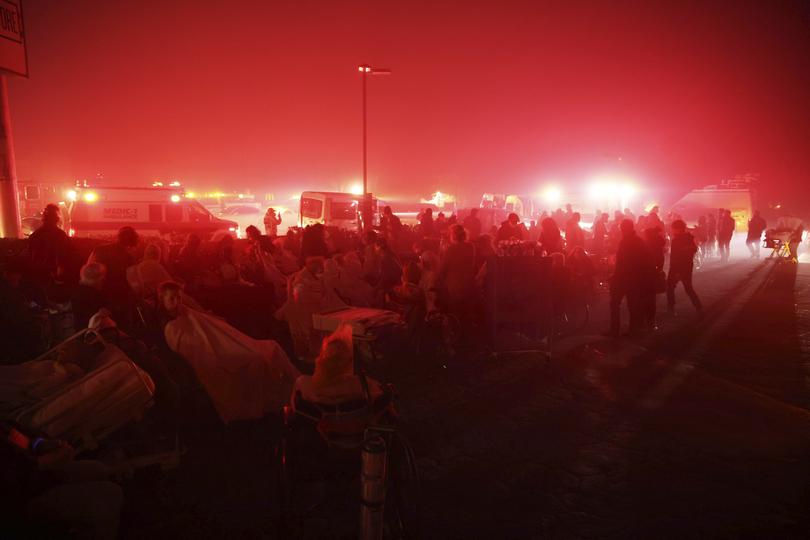 Residents of a senior center are evacuated as the Eaton Fire approaches Tuesday, Jan. 7, 2025 in Altadena, Calif. 