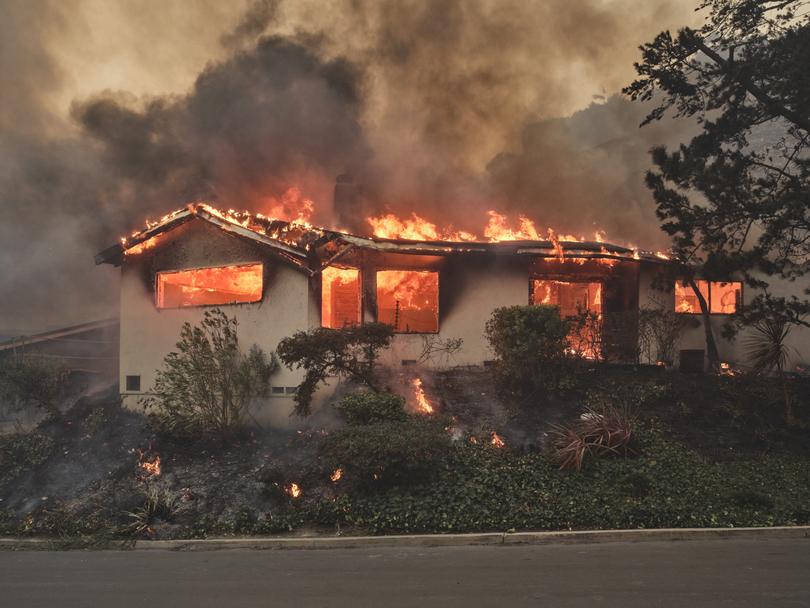 Fire destroys a home in the Pacific Palisades fire in Los Angeles, on Tuesday, Jan. 7, 2025. (Philip Cheung/The New York Times)