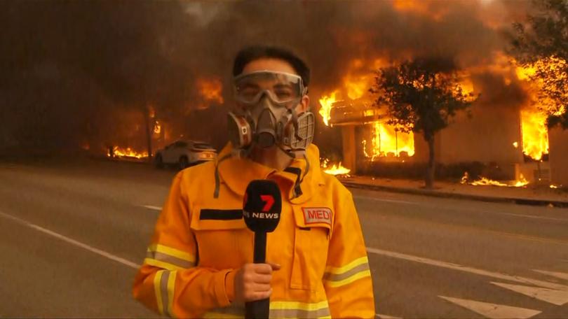 Sunrise reporter Isabelle Mullen was forced to take shelter on Thursday, reporting from the ground during the LA wildfires. 