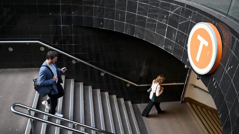 Commuters enter Martin Place train station in Sydney, Thursday, September 19, 2024. Sydney’s embattled train network faces disruptions as the rail union plans industrial action over a busy weekend of major football fixtures. (AAP Image/Bianca De Marchi) NO ARCHIVING