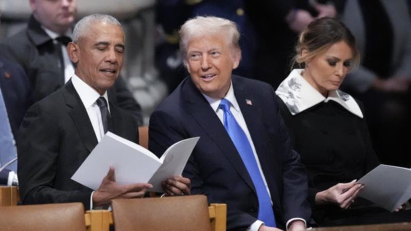 Ex-President Barack Obama and President-elect Donald Trump sat with each other at Jimmy Carter's funeral.