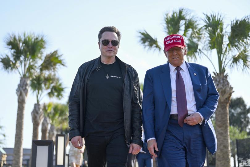 President-elect Donald Trump walks with Elon Musk before the launch of the sixth test flight of the SpaceX Starship rocket Tuesday, Nov. 19, 2024.