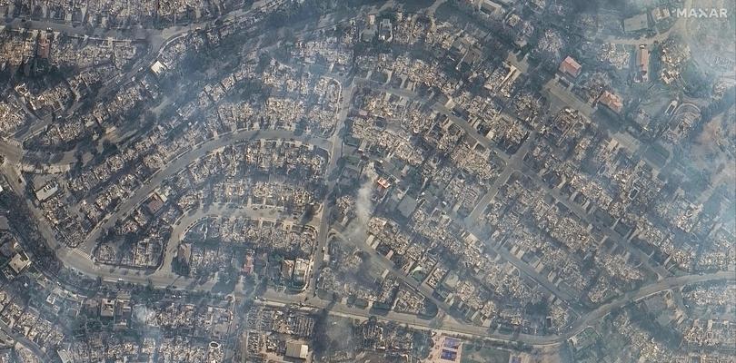 This satellite image provided by Maxar Technologies shows homes damaged from the Palisades Fire in the Pacific Palisades neighbourhood of Los Angeles, Thursday, Jan. 9, 2025. 