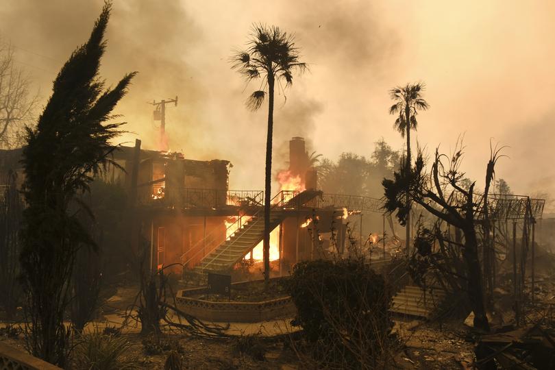 A home in Altadena burns to the ground as the Eaton Fire rages. 