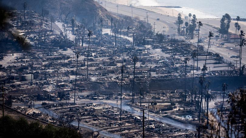 Businesses and homes burned along the Pacific Coast Highway in the Pacific Palisades neighborhood of Los Angeles on Thursday. 