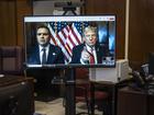 President-elect Donald Trump appears on a screen remotely for a sentencing hearing in the criminal case in which he was convicted in 2024 on charges involving hush money paid to a porn star, at New York Criminal Court.