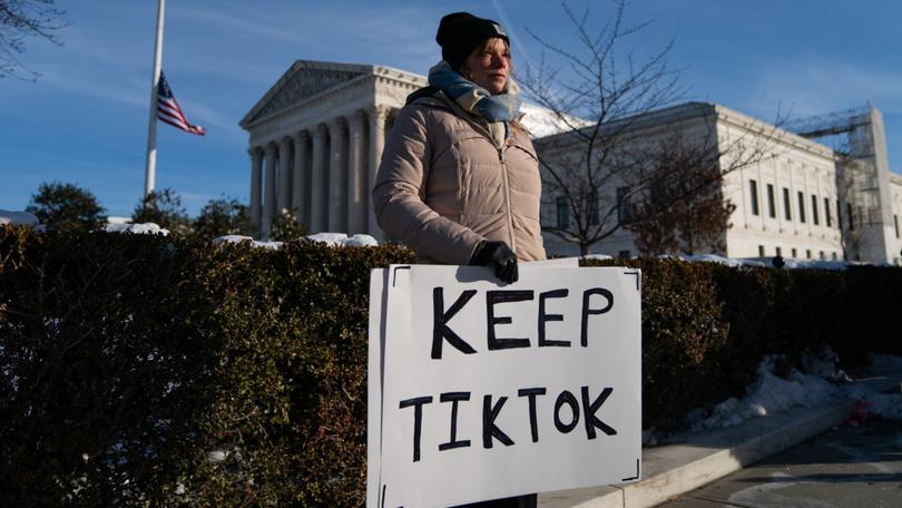 Sarah Bass, 27, holds a pro-TikTok sign in front of the Supreme Court ahead of arguments on social media app TikTok.