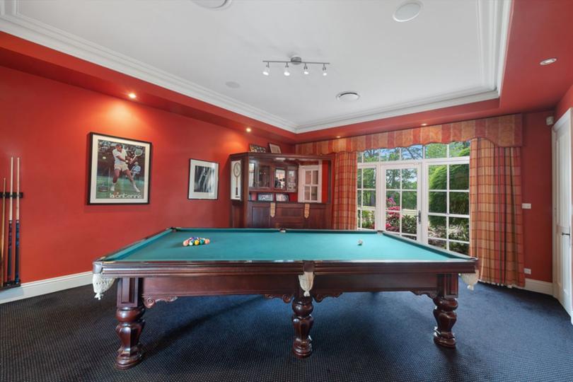 Photos of the current listing show tennis memorabilia, including trophies and championship shots.