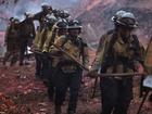 Firefighters hike into the Palisades wildfire in Los Angeles.