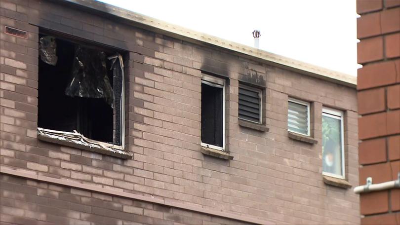 The woman who lived in the unit managed to evacuate but sustained burns in the process.