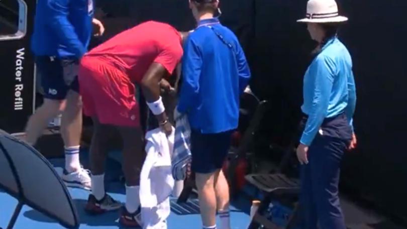 Frances Tiafoe throwing up on the sidelines.