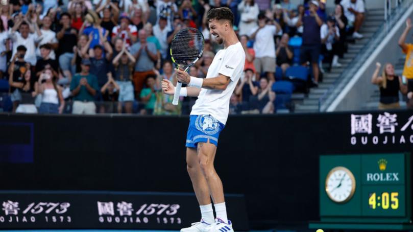 Thanasi Kokkinakis celebrates after a remarkable victory. 