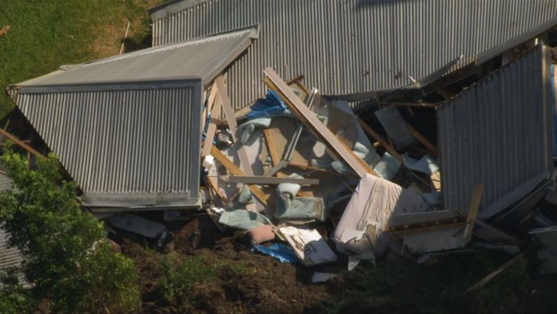 The home was completely destroyed in the landslide.