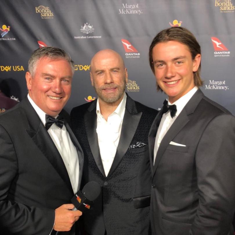 Eddie and Joe McGuire with John Travolta in 2019.