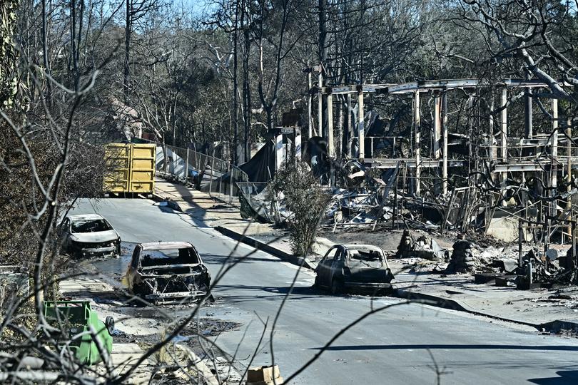 Cars destroyed by the Palisades Fire are seen in the Pacific Palisades neighborhood of Los Angeles, California, on January 12, 2025.