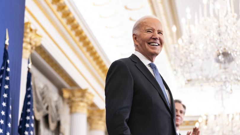 President Joe Biden greets the crowd before delivering  remarks about his foreign policy, at the State Department in Washington on Monday, Jan. 13, 2025