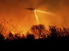 Firefighters are holding the line against LA wildfires that are still raging in extreme winds. (AP PHOTO)